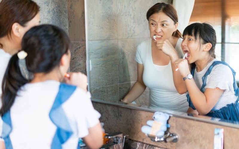 parent and child following a morning routine